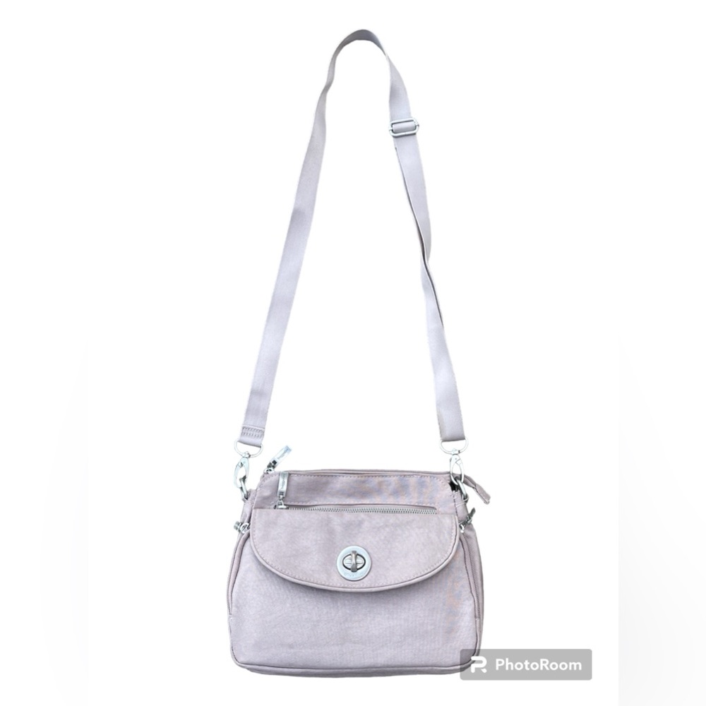 Used but good condition baggallini in shimmer blush